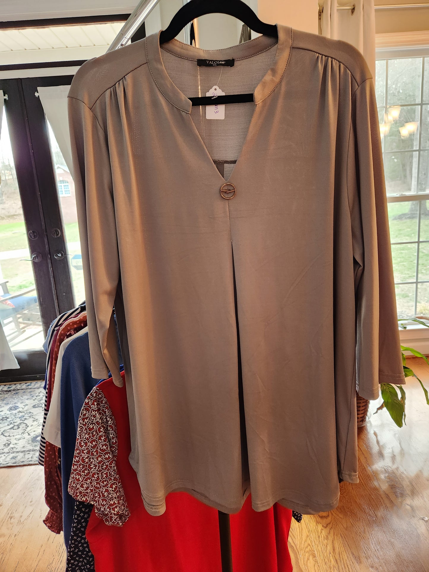 Tunic with neck and sleeve embellishment