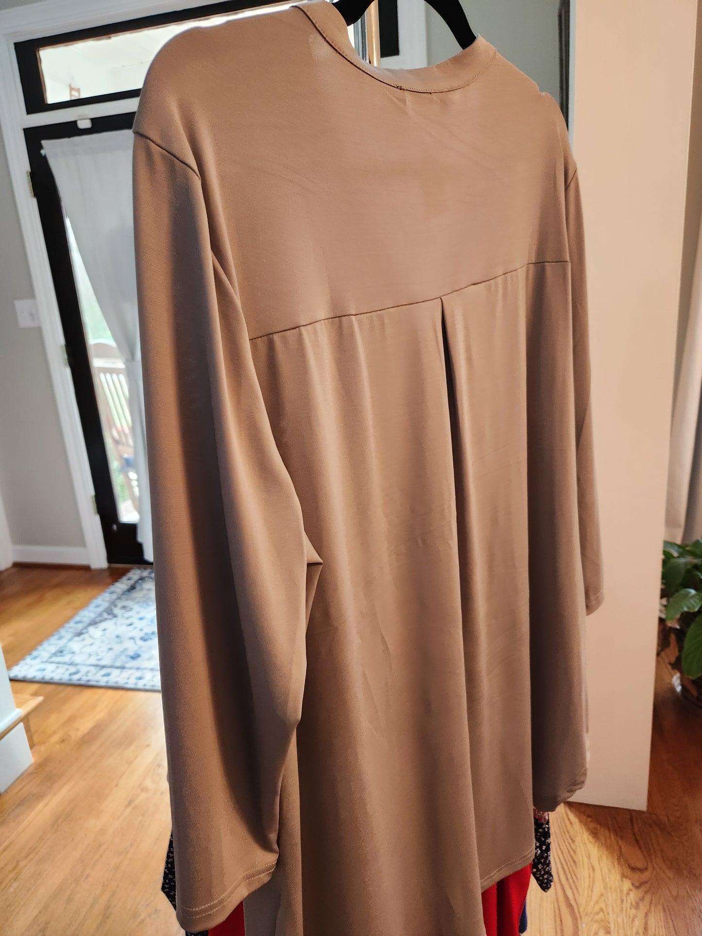 Tunic with neck and sleeve embellishment